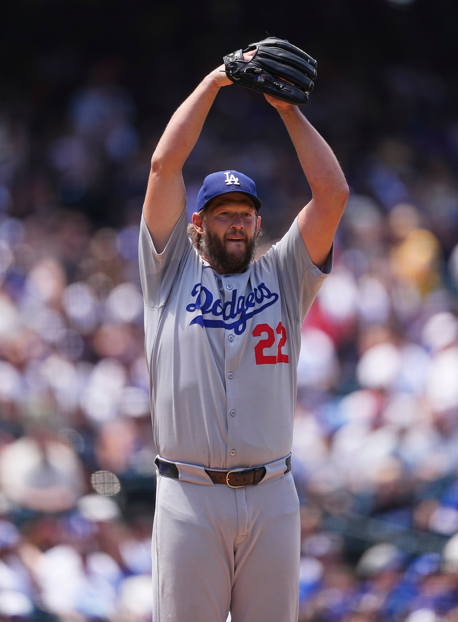 Los Angeles Dodgers starting pitcher Clayton Kershaw goes into the stretch to keep a runner on first base in the third inning of a baseball game against the Colorado Rockies, Thursday, June 26, 2025, in Denver. (AP Photo/David Zalubowski)