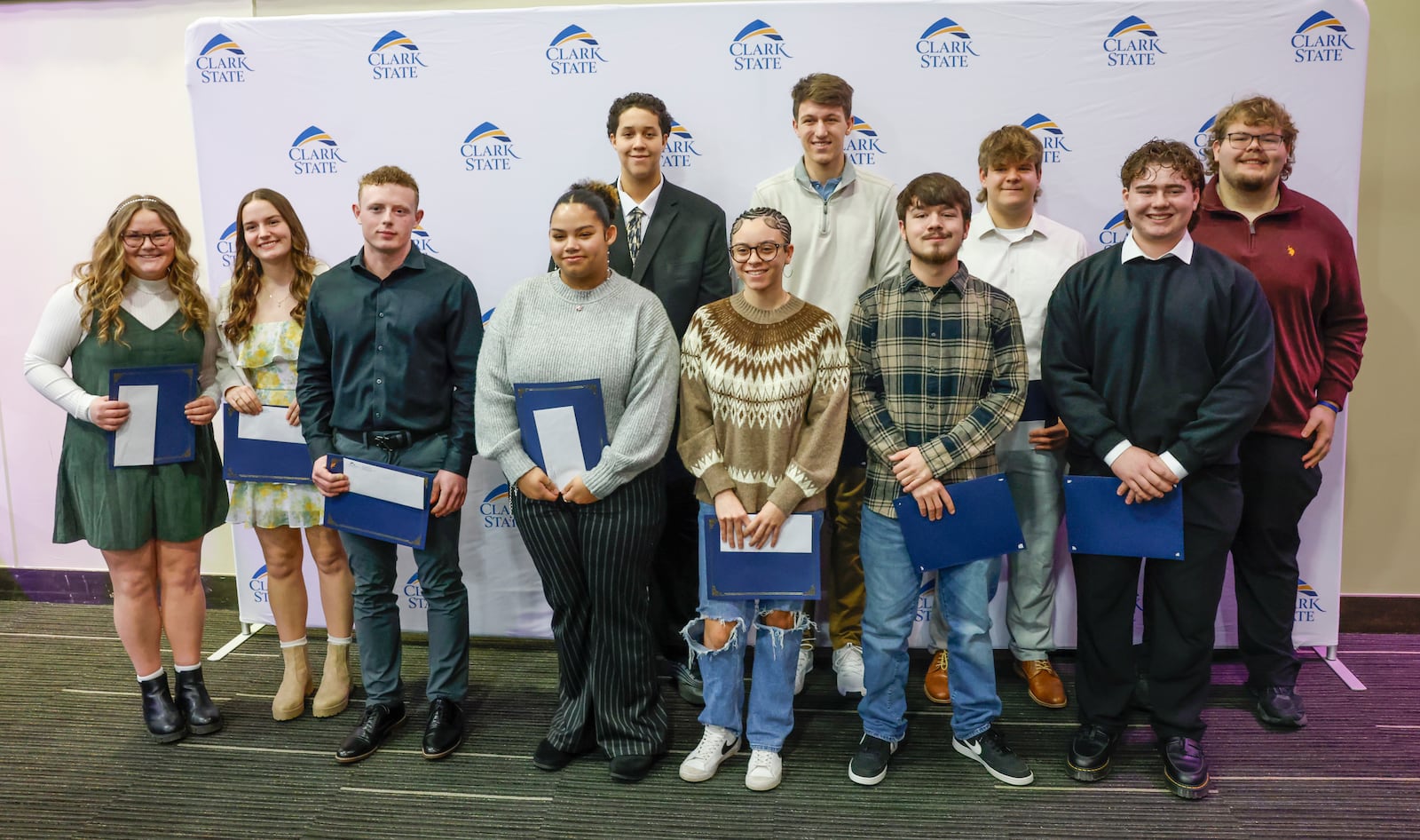 High school students show the Peacekeeper Awards they received at Clark State College's annual MLK luncheon and awards ceremony at the Hollenbeck Bayley Center on Friday, Jan. 16, 2026, in Springfield. JOSEPH COOKE/STAFF