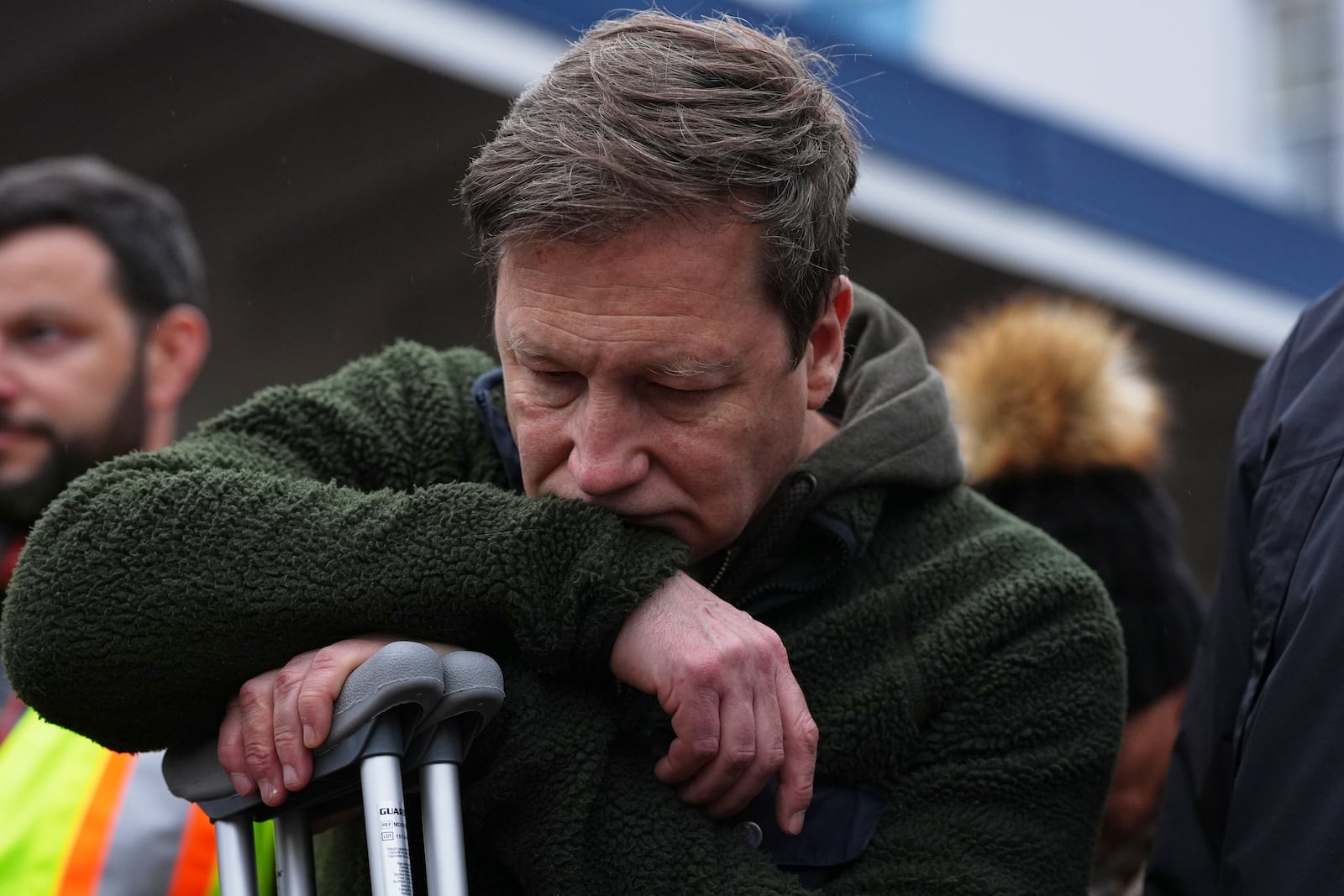 Noel Johansen, whose wife Jenifer Darbellay died after a vehicle drove into a crowd during a Filipino heritage festival, reacts at a vigil outside Sir Alexander Mackenzie Elementary School in Vancouver, British Columbia, Monday, April 28, 2025. (AP Photo/Lindsey Wasson)