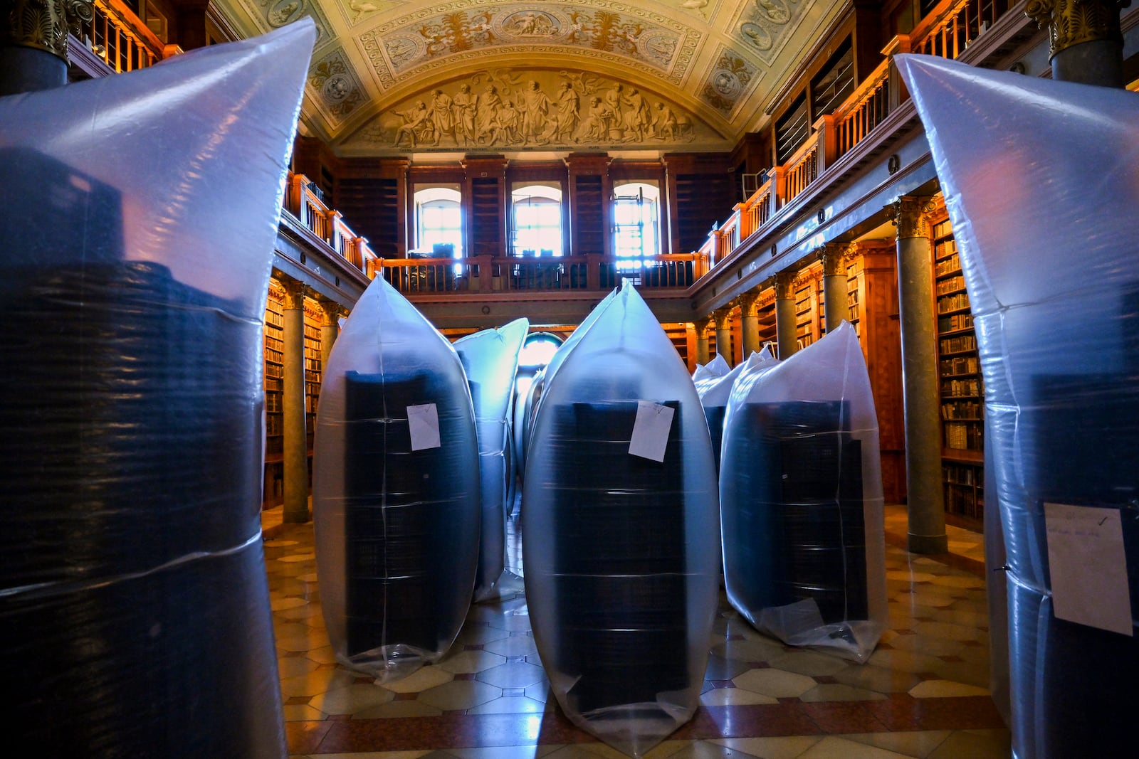 This photo provided by Pannonhalma Archabbey shows books kept in hermetically sealed plastic sacks for disinfection at the Pannonhalma Archabbey's library in Pannonhalma, Hungary, Thursday, July 3, 2025, as a beetle infestation threatens its ancient collection. (Pannonhalma Archabbey via AP)