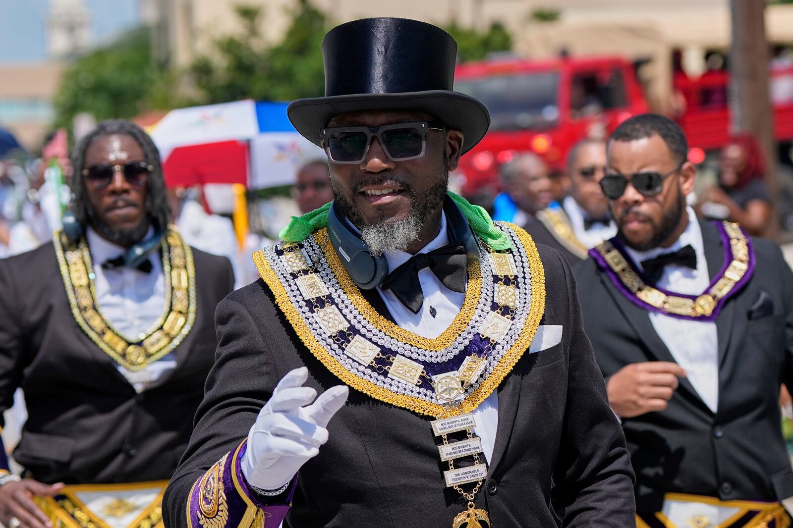 People participate during a Juneteenth parade Thursday, June 19, 2025, in Galveston, Texas. (AP Photo/David J. Phillip)