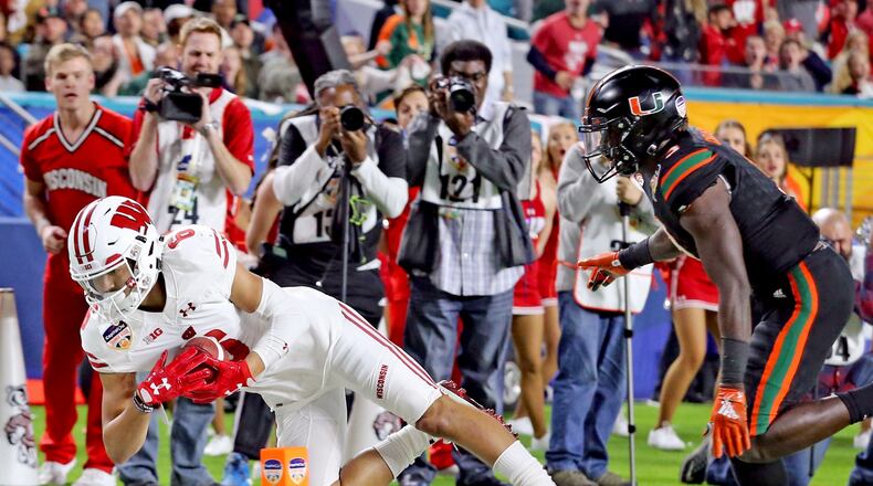 Miami’s Dee Delaney (3) fails to stop Wisconsin’s Danny Davis III (6) from catching a second-quarter touchdown during the Capital One Orange Bowl at Hard Rock Stadium in Miami Gardens, Fla., on Saturday, Dec. 30, 2017. (Charles Trainor Jr./Miami Herald/TNS)