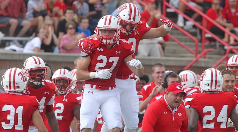 Wittenberg’s Jack Kayser (27) celebrates a stop against Wabash on Sept. 24, 2016, at Edwards-Maurer Field in Springfield. David Jablonski/Staff