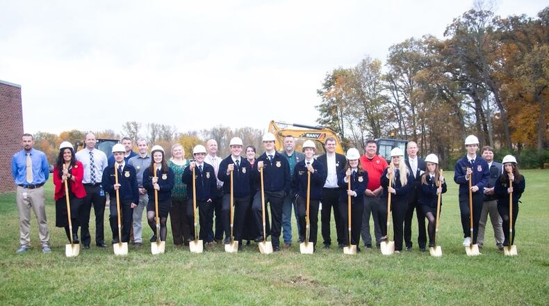 Triad Local School District FFA officers, board members and administrators from Triad and Ohio Hi-Point held a groundbreaking ceremony on Oct. 27 for the new agricultural FFA barn that will be located behind the high school. Contributed
