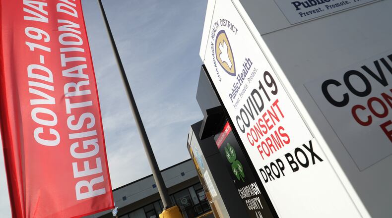 The COVID-19 vaccine registration drop box in front of the Champaign County Government Center. Five Champaign County school districts will be the first in the county to have over 400 employees get vaccinated for the coronavirus. BILL LACKEY/STAFF
