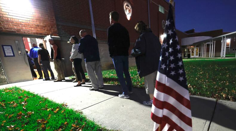 Clark County residents wait in line to cast their vote at Tecumseh High School early on Tuesday, Nov. 5, 2024. BILL LACKEY/STAFF