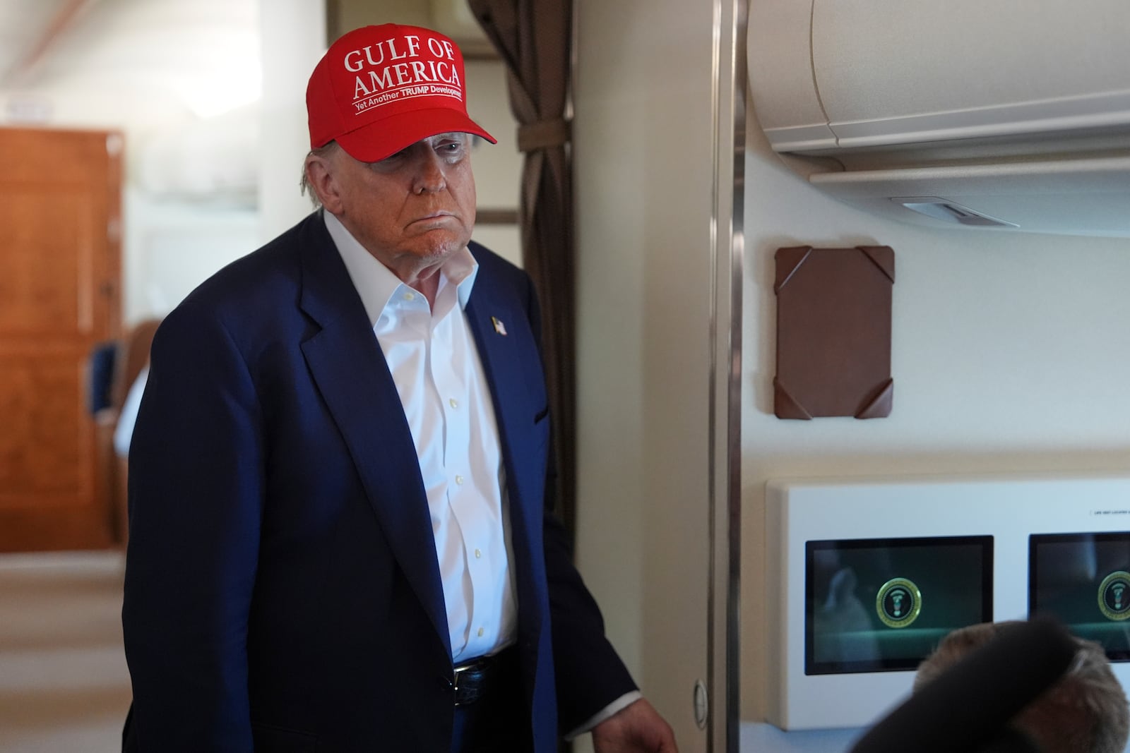 President Donald Trump talks with reporters on Air Force One after visiting a migrant detention center in Ochopee, Fla., Tuesday, July 1, 2025, as he heads back to Joint Base Andrew, Md. (AP Photo/Evan Vucci)