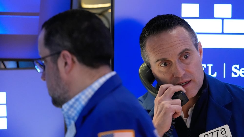 Michael Gagliano works on the floor at the New York Stock Exchange in New York, Friday, March 6, 2026. (AP Photo/Seth Wenig)