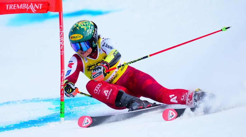 Julia Scheib, of Austria, speeds down the course as she races in the women's World Cup giant slalom in Mont Tremblant, Que., Sunday, Dec. 7, 2025. (Sean Kilpatrick /The Canadian Press via AP)