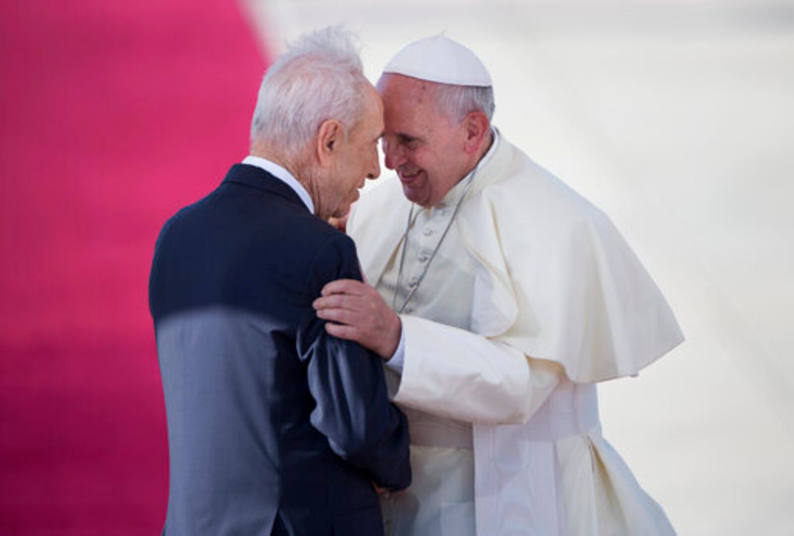 FILE - Pope Francis, right, talks with Israeli President Shimon Peres, during an official arrival ceremony at Ben Gurion airport near Tel Aviv, Israel, Sunday, May 25, 2014. (AP Photo/Oded Balilty, file)