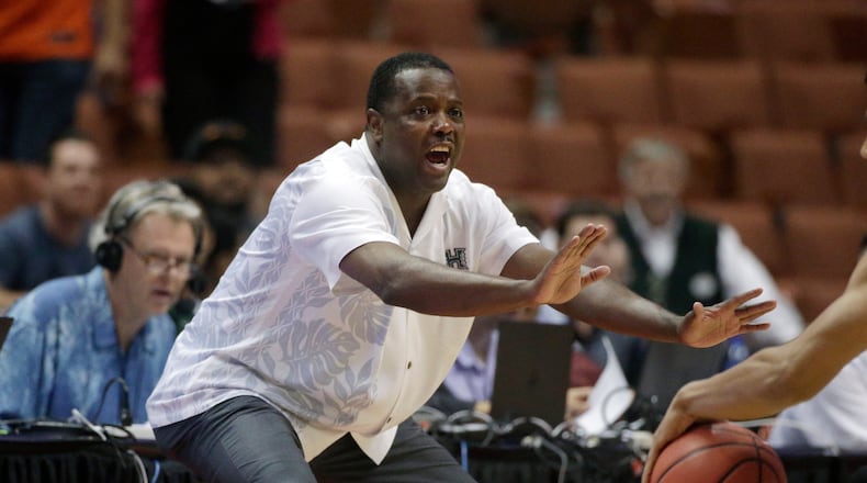 FILE - Hawaii coach Benjy Taylor gestures to his team during the first half of an NCAA college basketball game against UC Davis in the semifinals of the Big West Conference tournament, March 13, 2015, in Anaheim, Calif. (AP Photo/Jae C. Hong, File)
