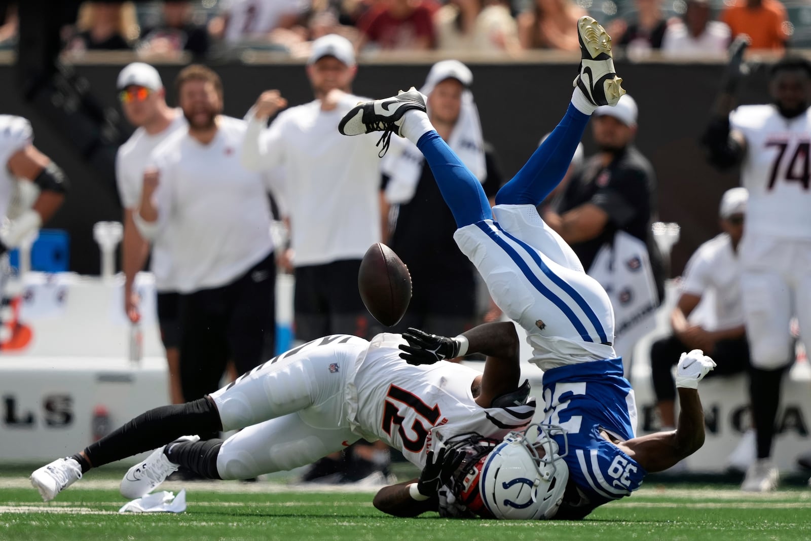 Cincinnati Bengals wide receiver Rashod Owens (12) cannot make a catch against Indianapolis Colts cornerback Alex Johnson (39) during the second half of a preseason NFL football game, Saturday, Aug. 23, 2025, in Cincinnati. (AP Photo/Carolyn Kaster)