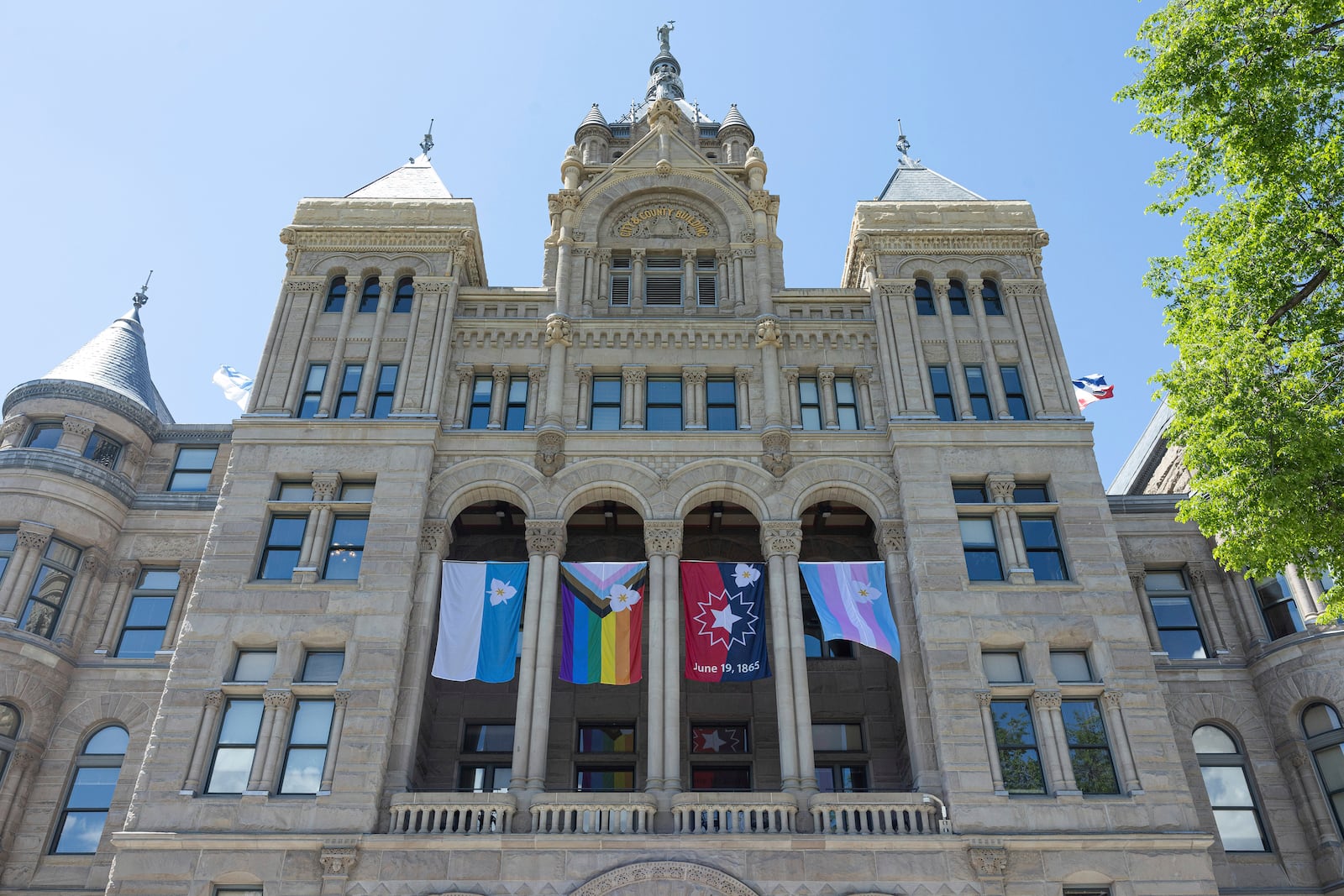 The newly adopted city flags are displayed at the Salt Lake City and County building showing support for LGBTQ+ in defiance of their state's Republican controlled Legislature, Wednesday, May 7, 2025, in Salt Lake City. (AP Photo/Melissa Majchrzak)