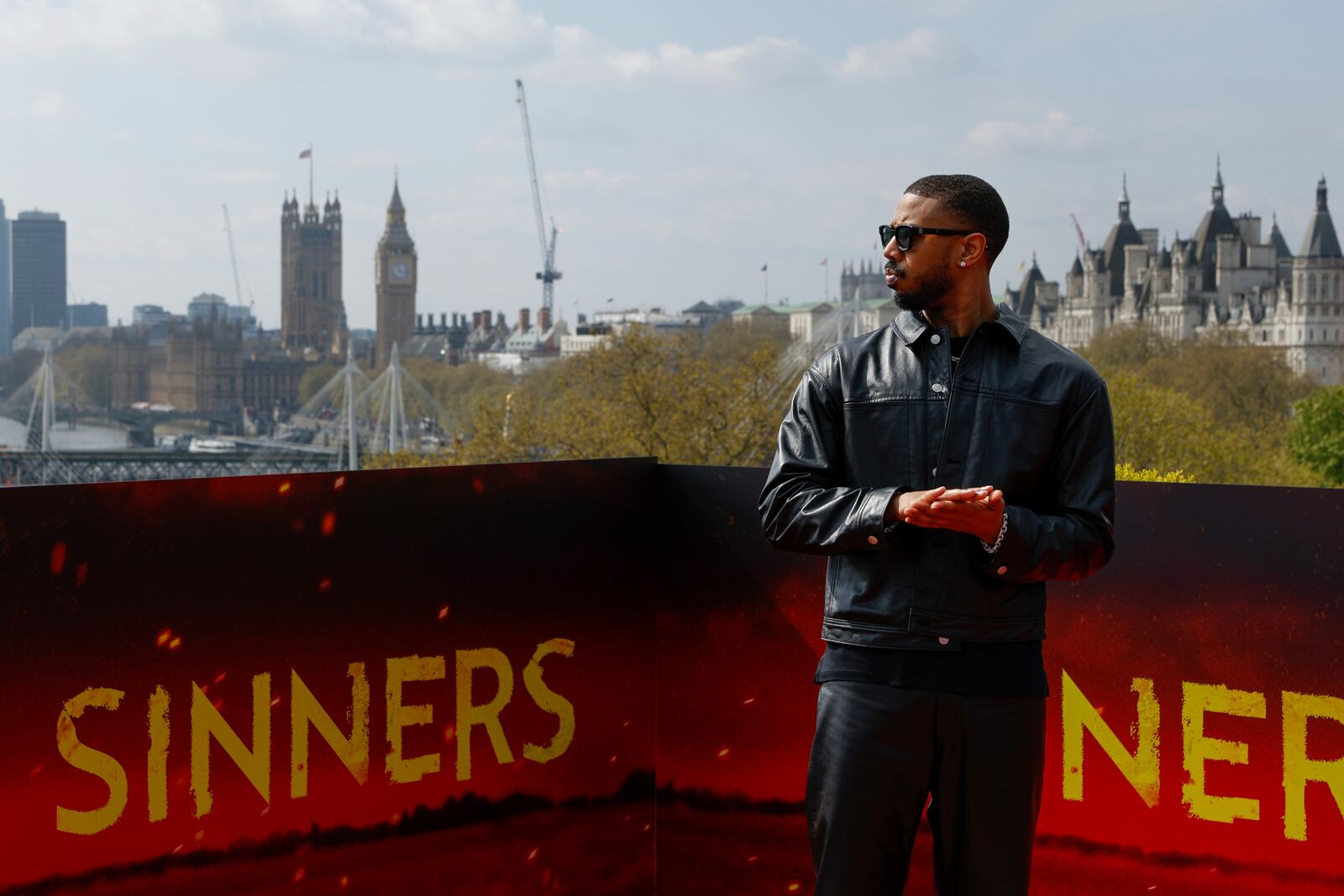 Michael B. Jordan poses for photographers during the photo call for the film 'Sinners' on Sunday, April 13, 2025, in London. (Photo by Millie Turner/Invision/AP)