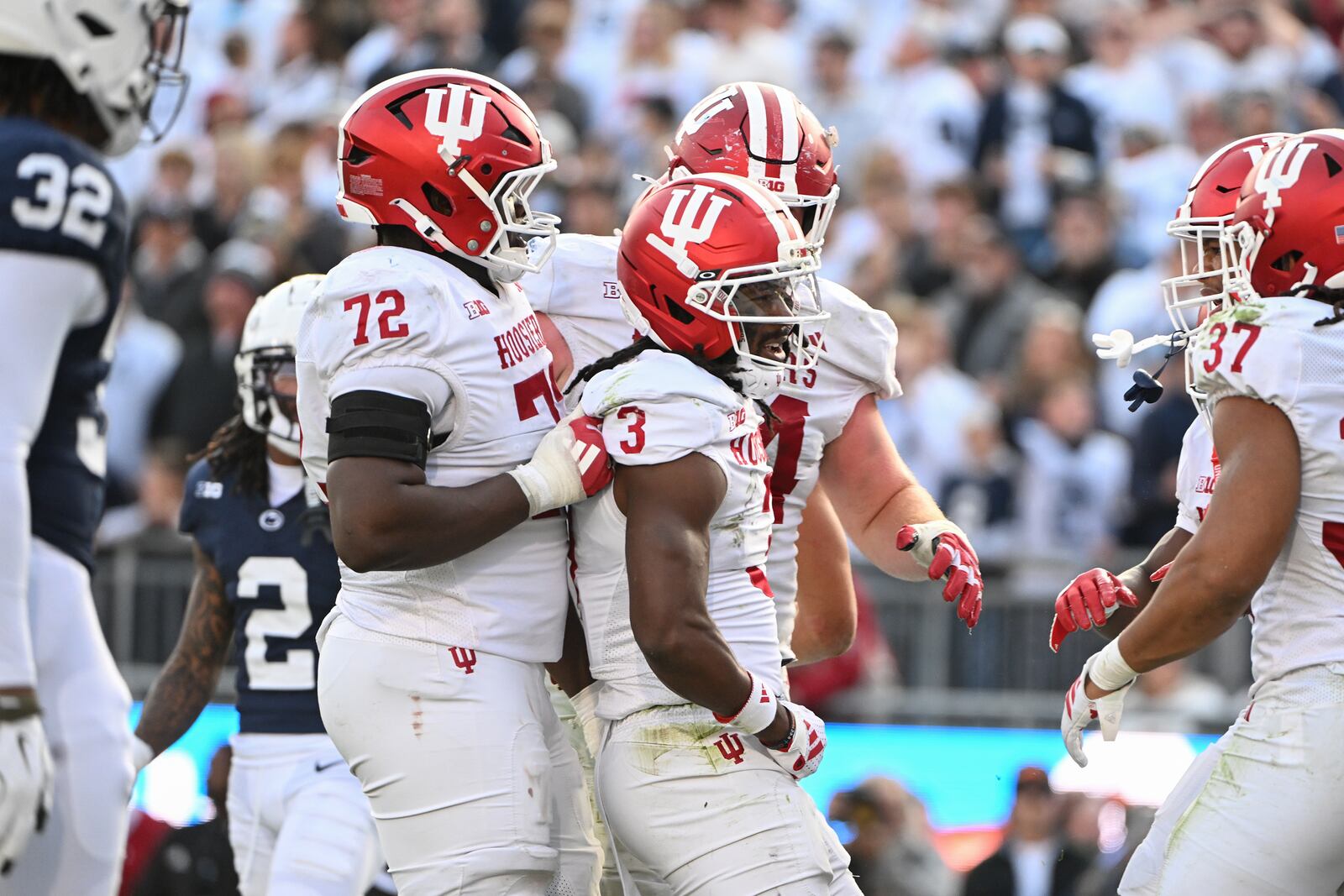 Indiana wide receiver Omar Cooper Jr. (3) celebrates a touchdown pass with offensive lineman Adedamola Ajani (72) during the fourth quarter of an NCAA college football game against Penn State, Saturday, Nov. 8, 2025, in State College, Pa. (AP Photo/Barry Reeger)