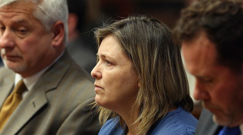 FILE - Angela Wagner sits next to her lawyers in the Pike County Common Pleas Court for her arraignment in Waverly, Ohio on Thursday, Nov. 29, 2018. Wagner, her husband and sons are charged in the 2016 Rhoden family shootings. (Brooke LaValley/The Columbus Dispatch via AP, File)