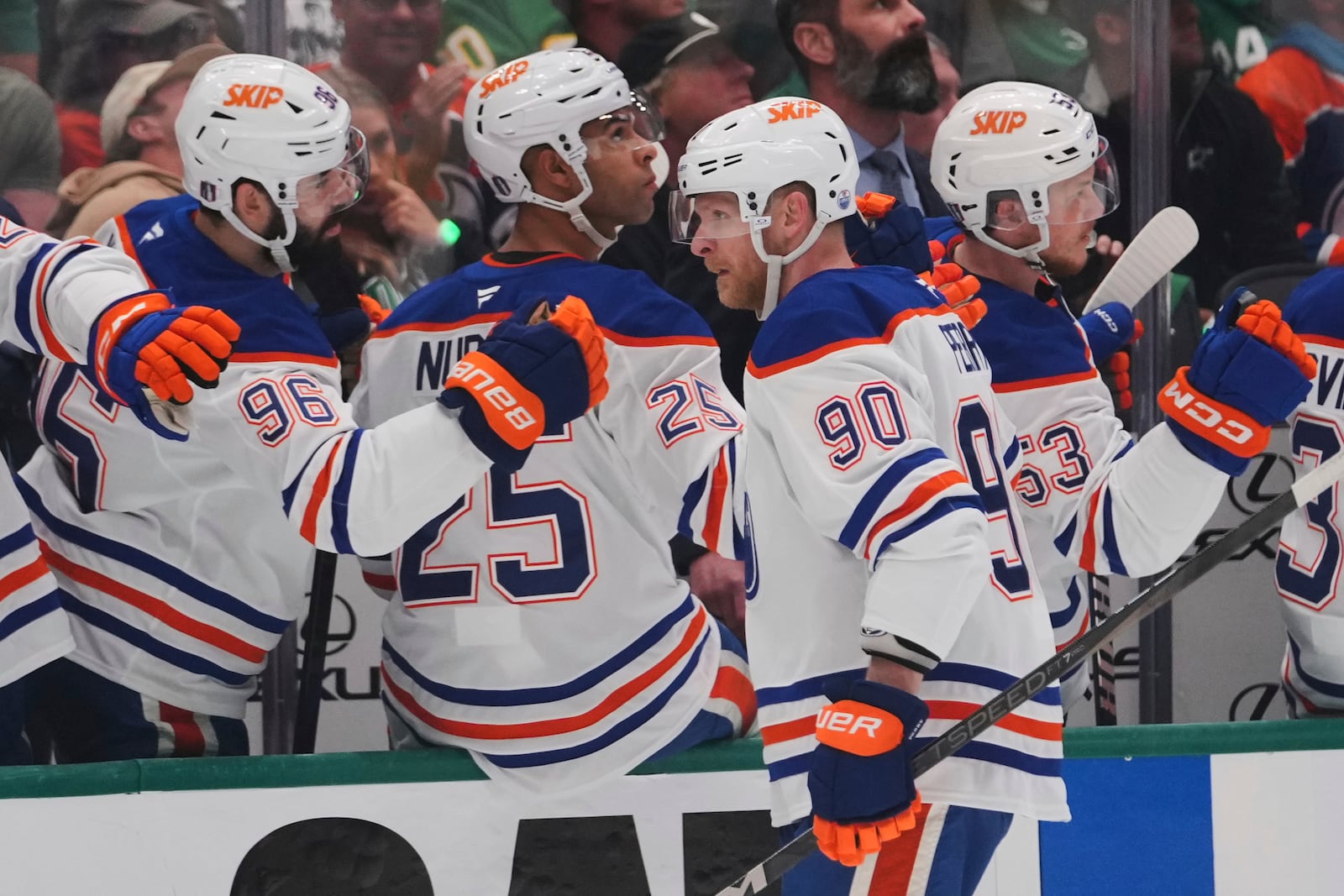 Edmonton Oilers right wing Corey Perry (90) celebrates with teammates after scoring against the Dallas Stars during the first period of Game 5 of the Western Conference finals in the NHL hockey Stanley Cup playoffs, Thursday, May 29, 2025, in Dallas. (AP Photo/Julio Cortez)