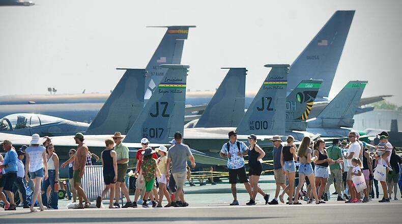 Dayton Air Show attendants wait to see inside several aircrafts on display on Sunday, July 23, 2023. MARSHALL GORBY \STAFF