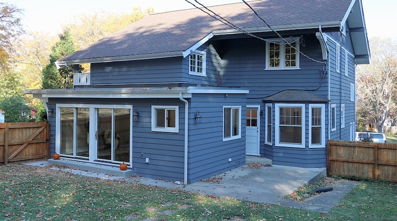 Wooden privacy fence surrounds the backyard, which has a concrete patio and a stepping-stone walkway to the two-car detached garage. Contributed photo by Kathy Tyler