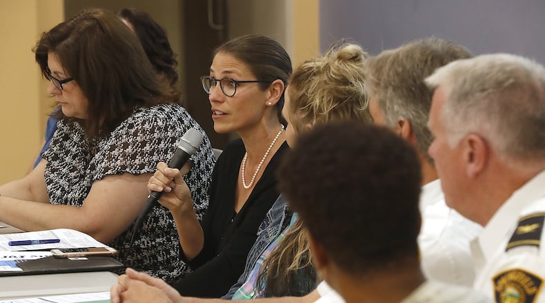 Greta Mayer, CEO the Mental Health and Recovery Board of Clark, Greene and Madison Counties, answers a question as part of the panel during the community-wide forum on the opioid crisis in Clark County Tuesday. Bill Lackey/Staff