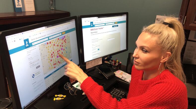 Ashlie Wilkson of the Miami Valley Better Business Bureau looks at scams on the BBB Scam Tracker. Scams increase around the holidays as consumers spend more money. JOHN NORTH for the Dayton Daily News