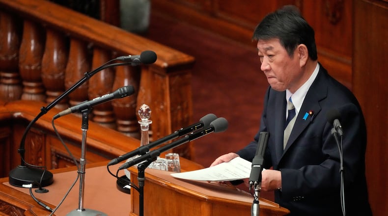 FILE -Japan's Foreign Minister Toshimitsu Motegi delivers a speech during the special Diet session, Feb. 20, 2026, in Tokyo. (AP Photo/Eugene Hoshiko, File)
