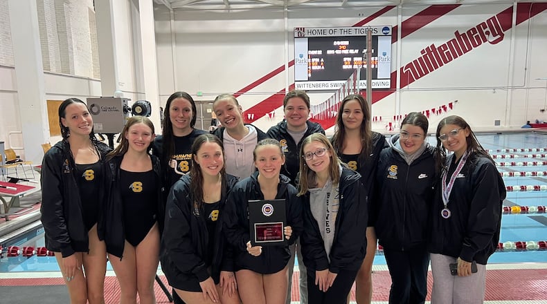 The Shawnee High School girls swimming team poses with the trophy after winning the 2026 Clark County Swimming Championship meet on Sunday, Feb. 8, at the Wittenberg Natatorium in Springfield. CONTRIBUTED PHOTO