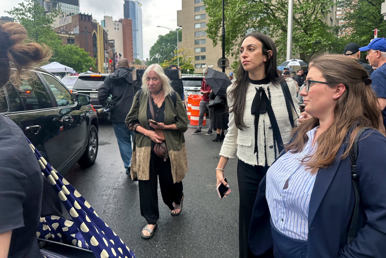 Defense attorney Teny Geragos, center, exits court during the Sean "Diddy" Combs' sex trafficking trial, Tuesday, May 13, 2025. (AP Photo/Ted Shaffrey)