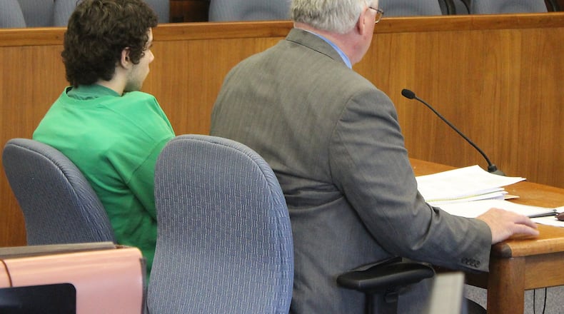 Ely Serna (left) and his attorney, Dennis Lieberman during arraignment proceedings in Champaign County Common Pleas Court. JEFF GUERINI/STAFF