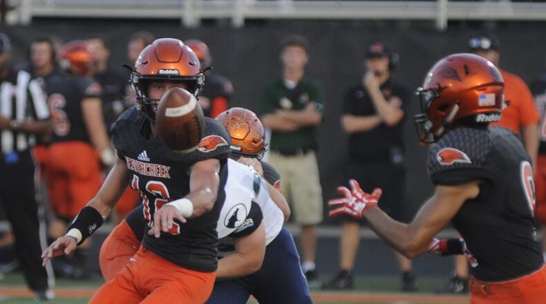 Beavercreek QB Jake Maloney pitches to Drew Nanda. Beavercreek defeated visiting Fairmont 14-3 in a GWOC National East high school football opener on Friday, Sept. 22, 2017. MARC PENDLETON / STAFF