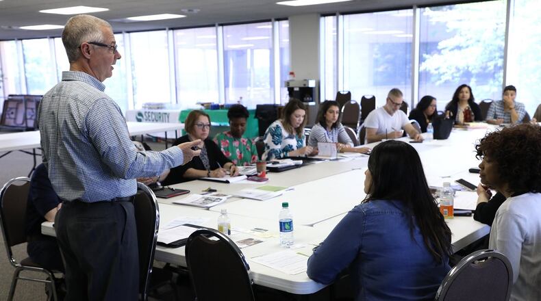 Carl Ruby, senior pator of Central Christian Church and executive director of Welcome Springfield, talks to the Clark County Latino Coalition during their first meeting Thursday after a two year hiatus. Bill Lackey/Staff