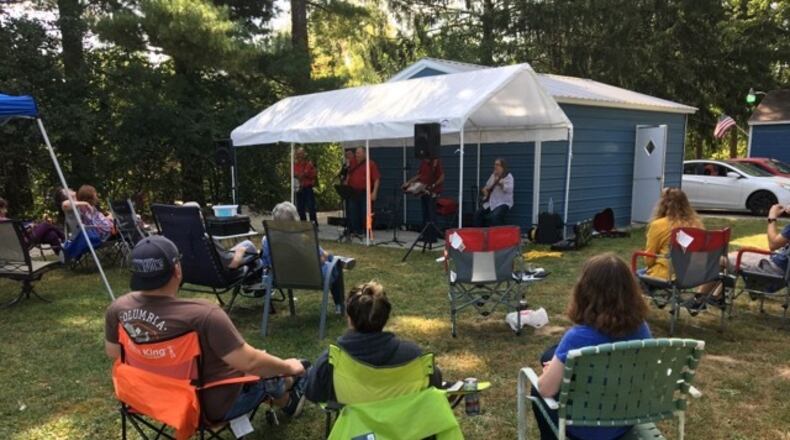 Jim and Becky Jones had the lawn chairs of honor closest to the band. This private concert and family gathering was possible because of the distancing, but they were close enough to share in laughter and conversation. PAM COTTREL/CONTRIBUTED