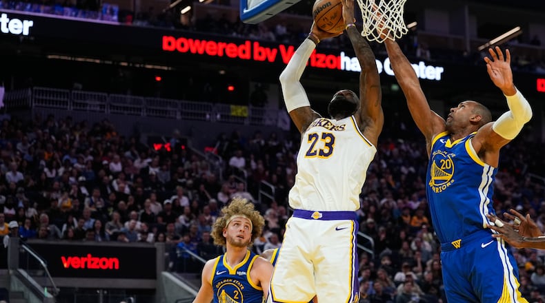 Los Angeles Lakers forward LeBron James (23) shoots while defended by Golden State Warriors center Al Horford (20) during the first half of an NBA basketball game, Saturday, Feb. 28, 2026, in San Francisco. (AP Photo/Godofredo A. Vásquez)