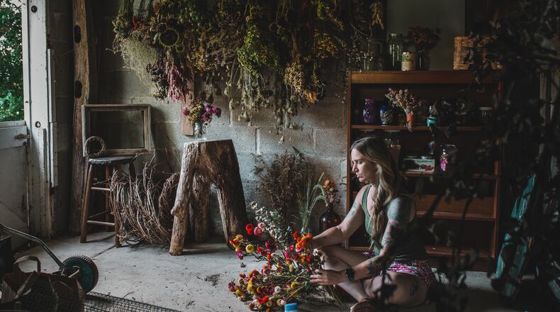 Carly Short works on floral arrangements at her home in West Milton. Contributed photos