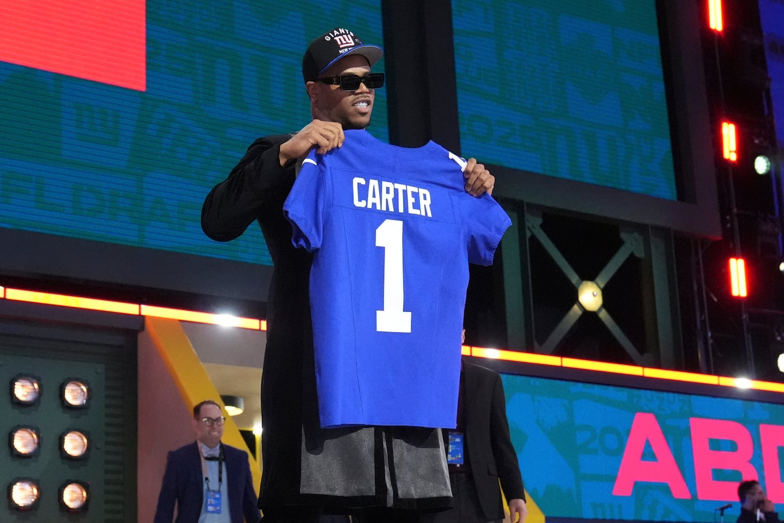 Penn State defensive end Abdul Carter poses after being chosen by the New York Giants with the third overall pick during the first round of the NFL football draft, Thursday, April 24, 2025, in Green Bay, Wis. (AP Photo/Jeff Roberson)