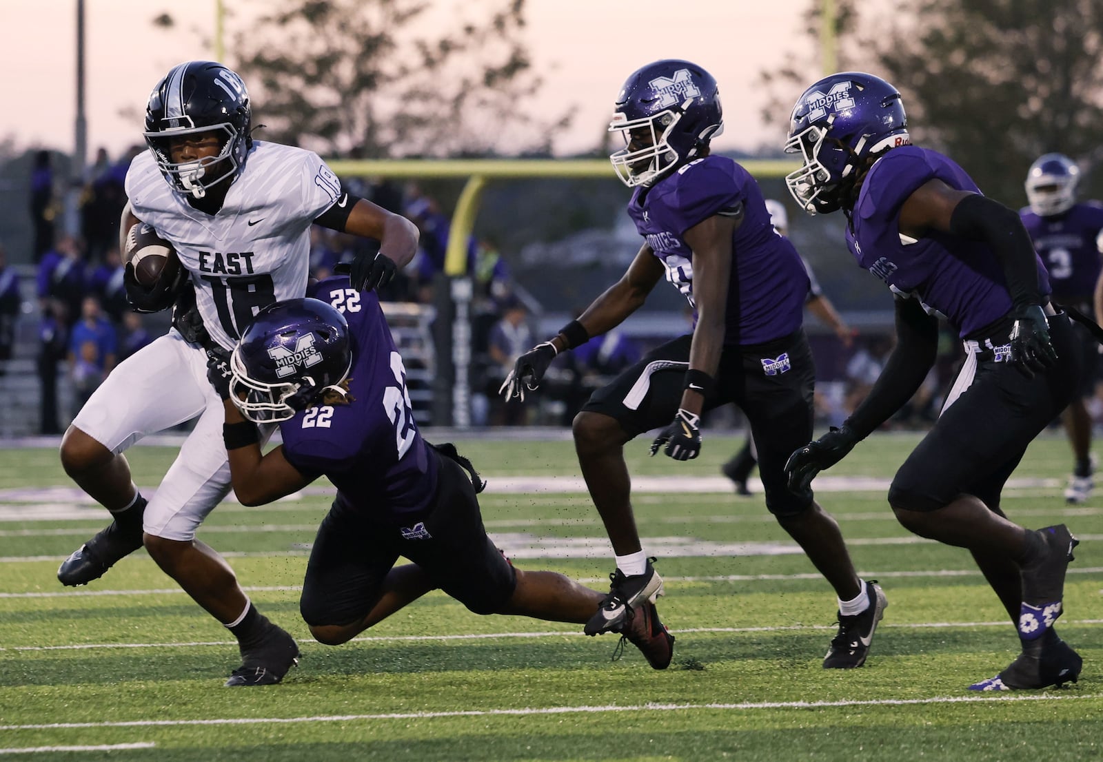 Lakota East's Christopher Bouyer is pushed out of bounds by Middletown's Chris Hyde during their football game Friday, Oct. 3, 2025 at Barnitz Stadium in Middletown. The Middies won 27-6. NICK GRAHAM/STAFF
