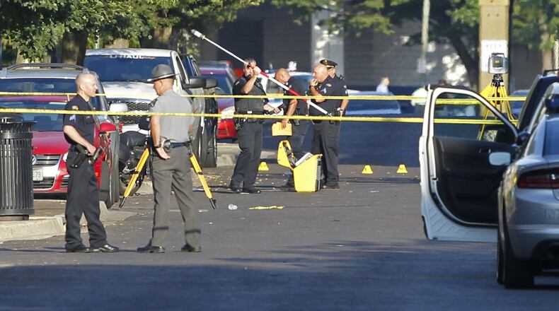 Scene in the Oregon District where 10 people were killed, including the shooter, in a mass shooting that also injured more than two dozen others. The shooting took place in the 400 block of East Fifth Street at 1:07 A.M.  TY GREENLEES / STAFF
