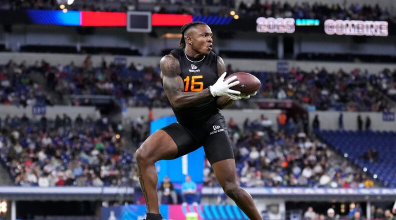 Iowa running back Kaleb Johnson runs a drill at the NFL football scouting combine in Indianapolis, Saturday, Feb. 1, 2025. (AP Photo/George Walker IV)