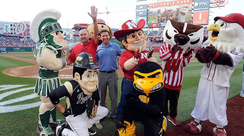 WASHINGTON, DC - JUNE 30: Big Ten Commissioner Jim Delany and Big Ten Network president Mark Silverman pose with the Big Ten mascots and Natioanls mascot Screech before the game between the Washington Nationals and the Colorado Rockies at Nationals Park on June 30, 2014 in Washington, DC. (Photo by Greg Fiume/Getty Images)