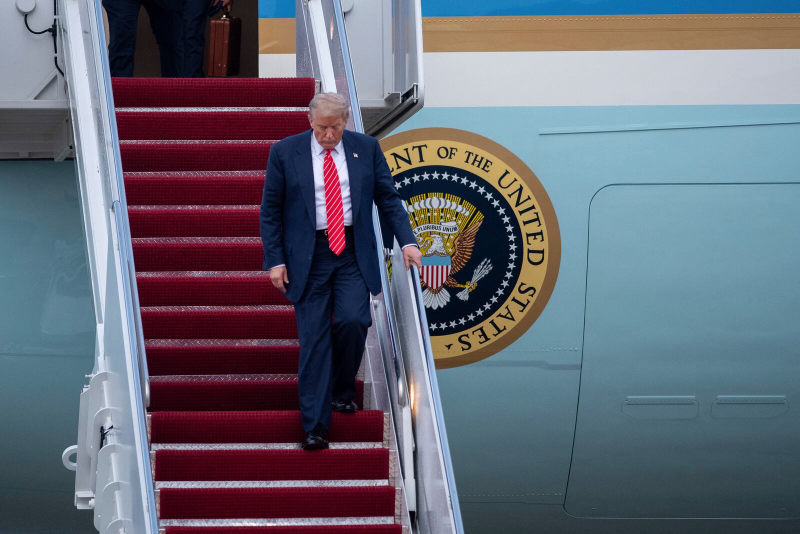 President Donald Trump exits Air Force One at Joint Base Andrews, Md., Wednesday, June 25, 2025. (AP Photo/Cliff Owen)
