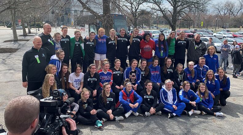 Beloit West Branch and Dayton Carroll pose for a group photo outside St. John Arena after their Division II state semifinal game at St. John Arena in Columbus was postponed. Eric Frantz/CONTRIBUTED