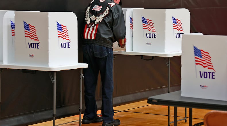 A New Carlisle resident casts his vote Tuesday, May 2, 2023 at Tecumseh High School. BILL LACKEY/STAFF