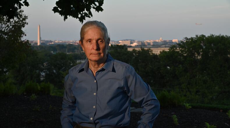 Photos of Deb Loewer from the ridge above the Pentagon with Deb’s former office and area where the plane struck on 9.11 over her shoulder.