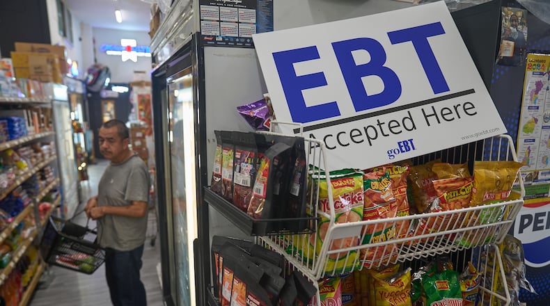 FILE - A banner reads: "EBT (Electronic Benefit Transfer) Accepted Here," at El Recuerdo Market in Los Angeles, Oct. 31, 2025, after two federal judges ordered President Donald Trump's administration to continue funding SNAP during the government shutdown. (AP Photo/Damian Dovarganes, file)