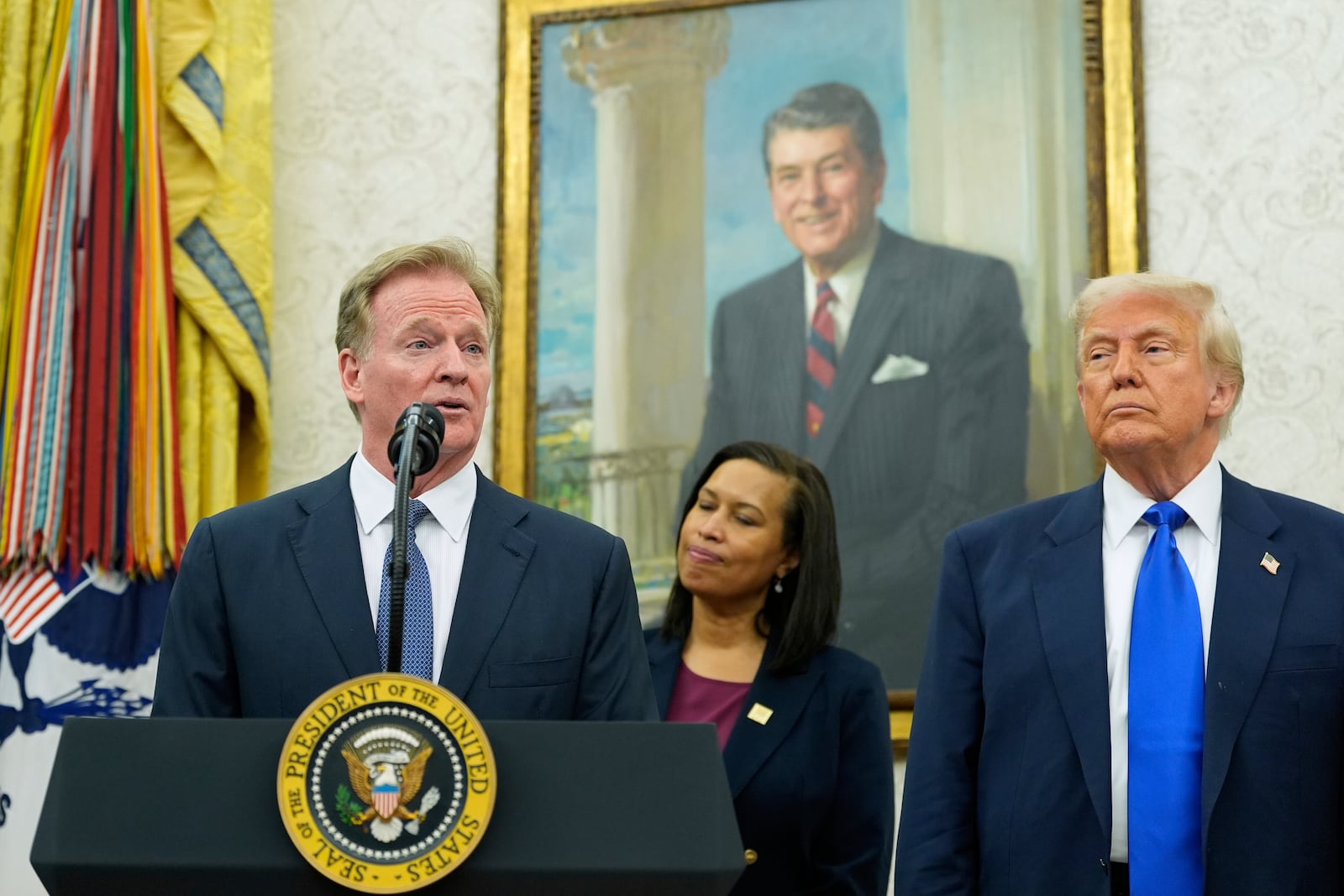 NFL Commissioner Roger Goodell, from left, speaks as District of Columbia Mayor Muriel Bowser and President Donald Trump listen during an event to announce that the 2027 NFL Draft will be held on the National Mall, in the Oval Office of the White House, Monday, May 5, 2025, in Washington. (AP Photo/Alex Brandon)