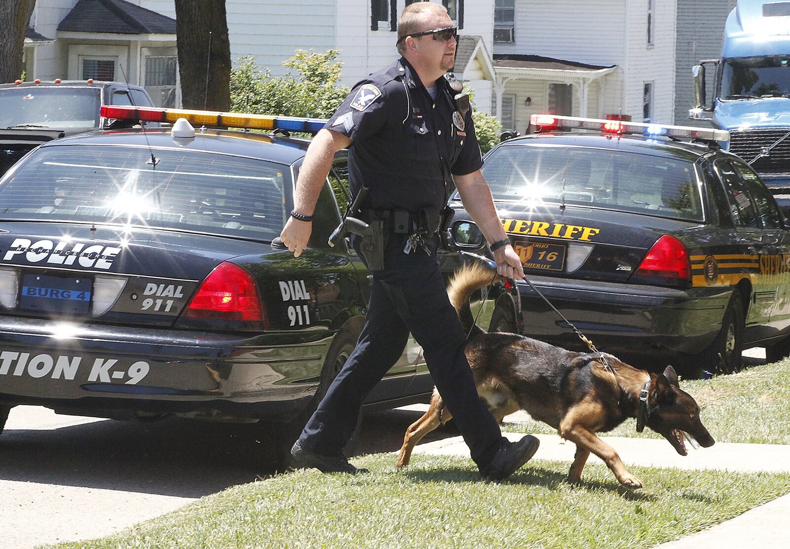 Sgt. Nickolous Black and his K-9 Officer Max. The village of Mechanicsburg came together to raise the $20,000 to buy and train Max. Bill Lackey/Staff
