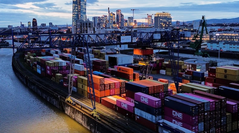 Containers are stored in a cargo terminal in Frankfurt, Germany, Monday, Feb. 23, 2026. (AP Photo/Michael Probst)