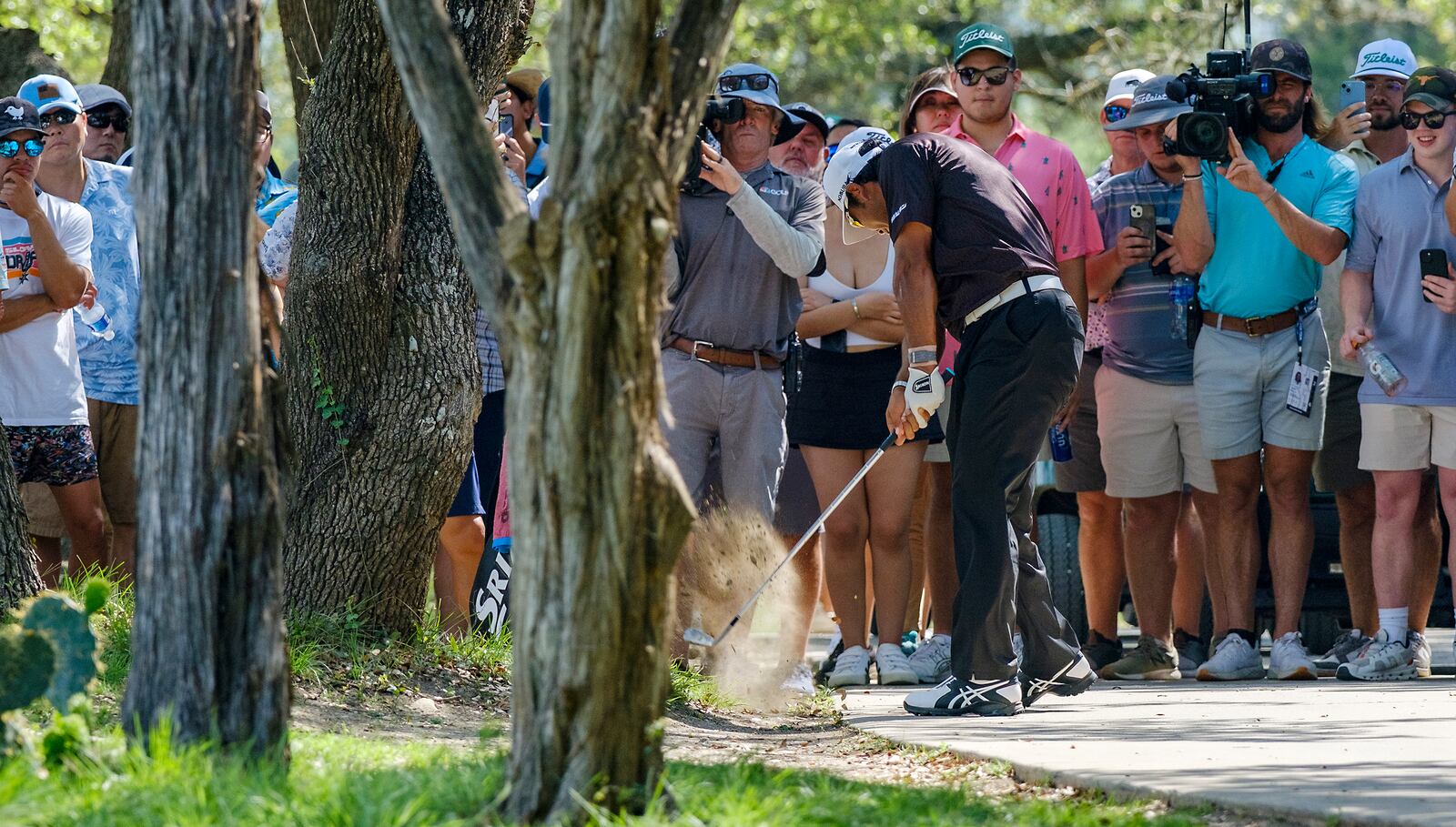 Hideki Matsuyama, of Japan, hits out of the rough on the 12th hole during the first round of the Texas Open golf tournament, Thursday, April 3, 2025, in San Antonio, Texas. (AP Photos/Rodolfo Gonzalez)