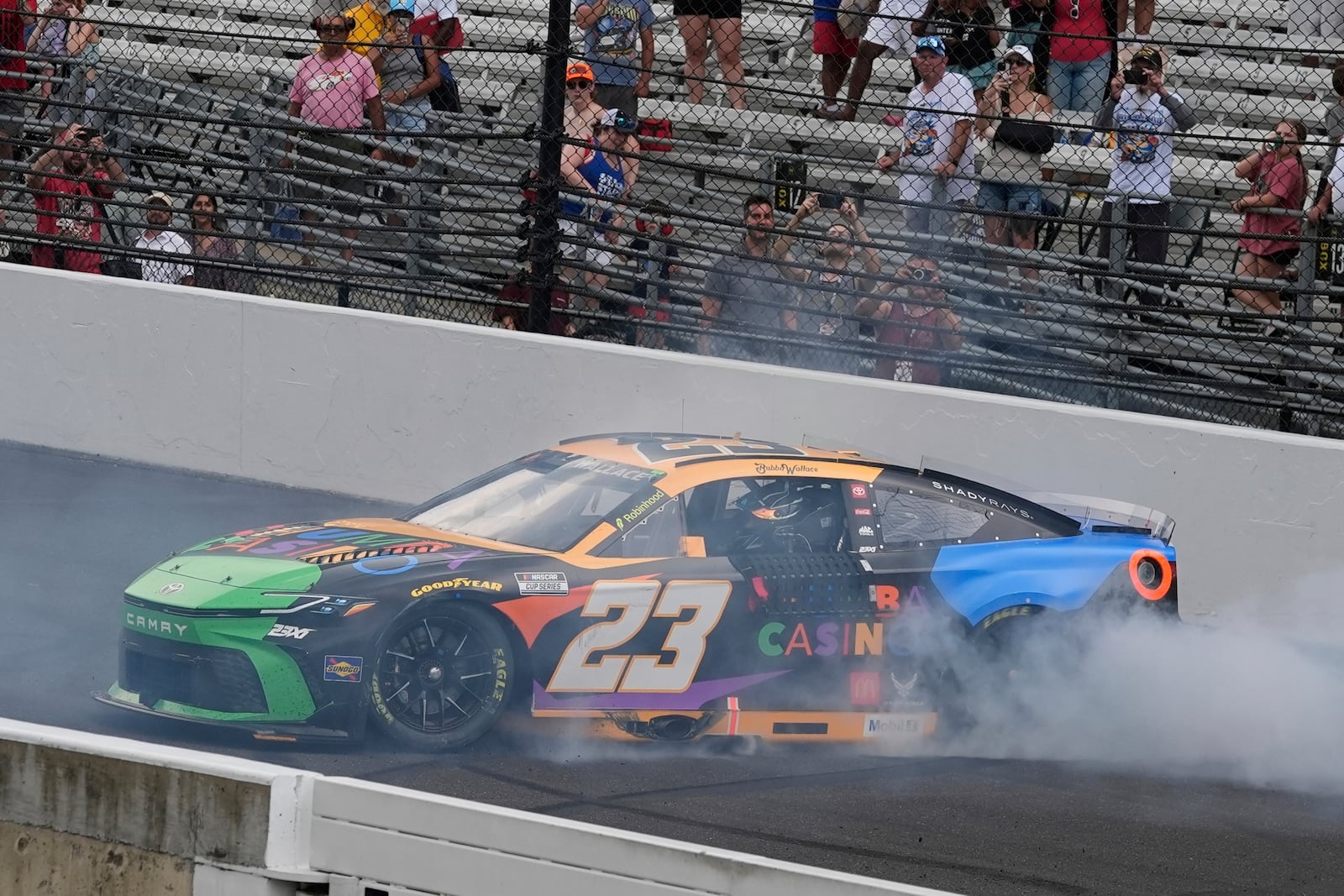 Bubba Wallace celebrates after winning a NASCAR Cup Series auto race at Indianapolis Motor Speedway, Sunday, July 27, 2025, in Indianapolis. (AP Photo/Darron Cummings)