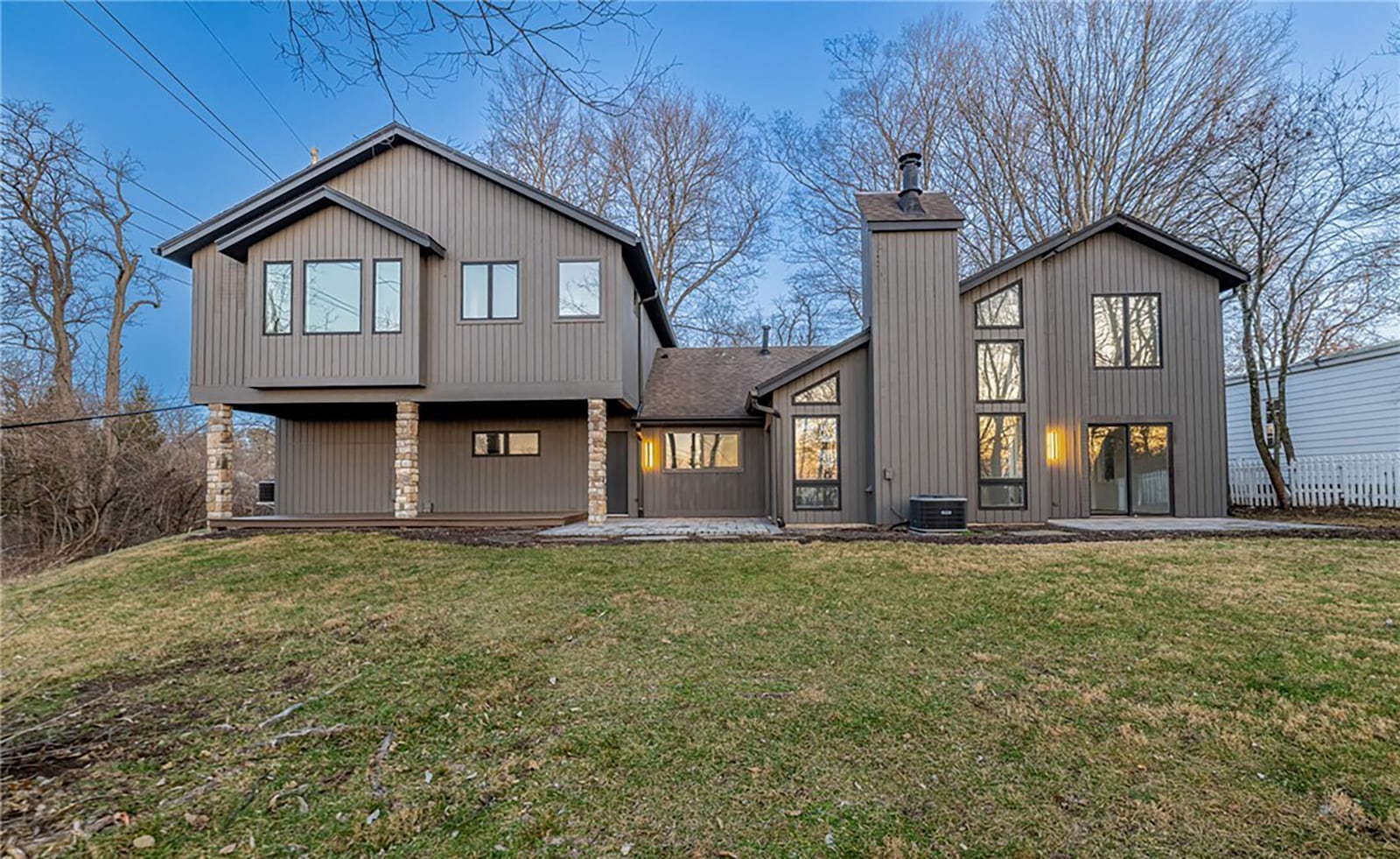 The back of the home has two flagstone paver patios and a covered deck overlooking the tree lined back yard. CONTRIBUTED